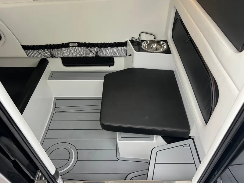 Slide: The Image of 2026 Nor-Tech 340 Sport interior with seating and sink, featuring modern design and functionality. - 26