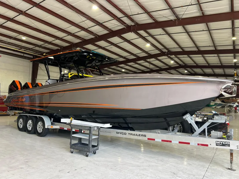 Slide: The Image of 2026 Nor-Tech 340 Sport boat on trailer in warehouse setting. - 5