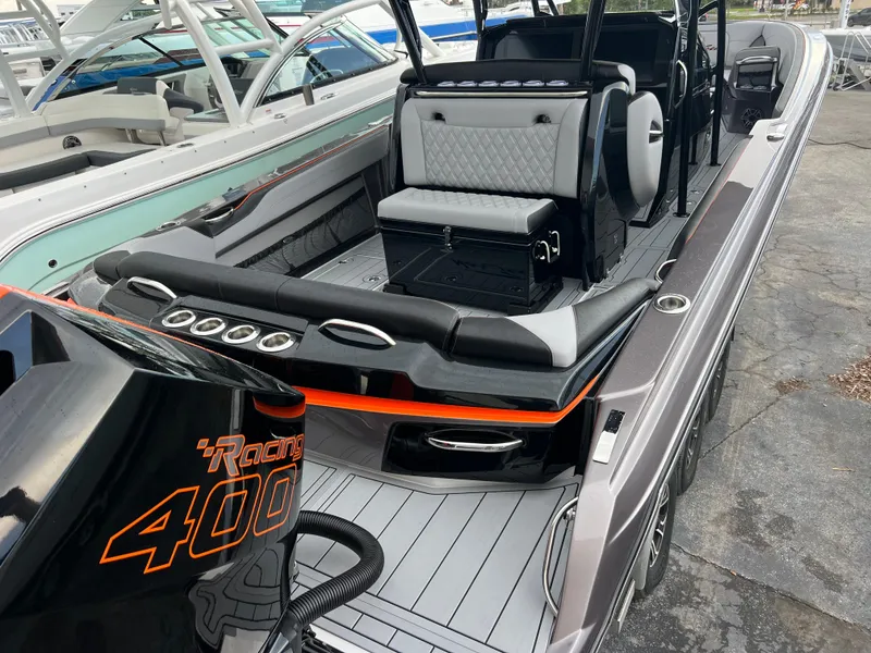 Slide: The Image of 2026 Nor-Tech 340 Sport boat with sleek seating and powerful Racing 400 engine. - 8