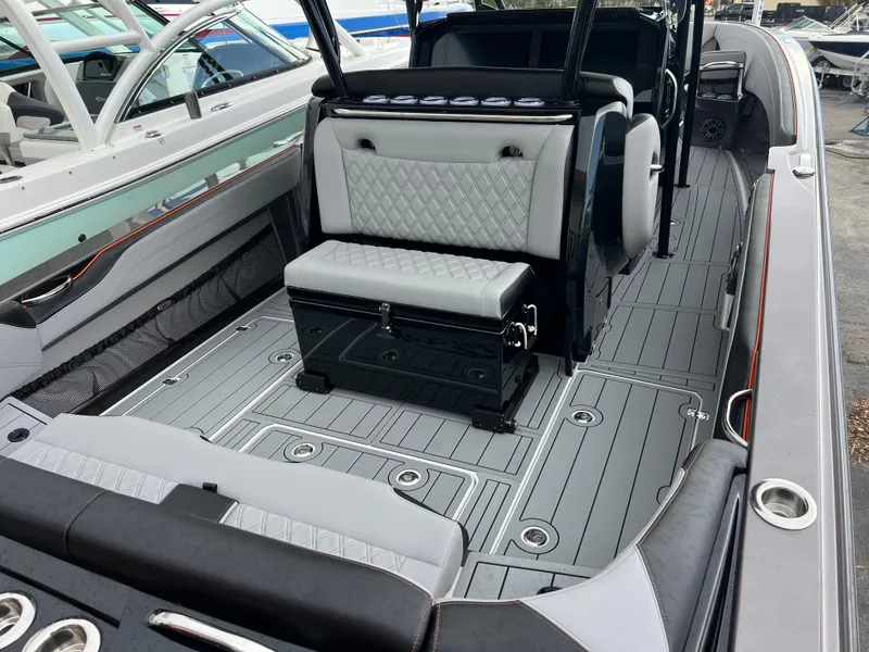 Slide: The Image of 2026 Nor-Tech 340 Sport boat interior with sleek seating and modern design. - 9