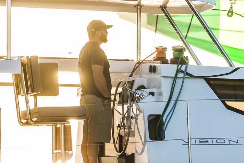 Slide: The Image of Man steering Vision 444 yacht at sunset, 2025 model. - 16