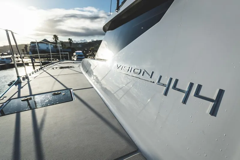 Slide: The Image of Sleek Vision 444 yacht docked at marina, 2025 model. - 18