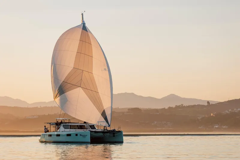 Slide: The Image of Vision 444 sailboat on calm water at sunset, 2025 model. - 6