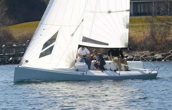 The Image of 2025 J Boats J/70 sailing on a calm lake with crew onboard. - 1