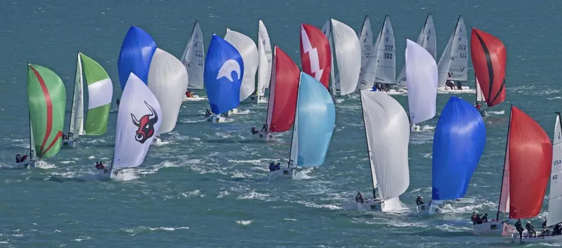 Slide: The Image of Sailboats racing with colorful spinnakers, J Boats J/70 model, 2025. - 4