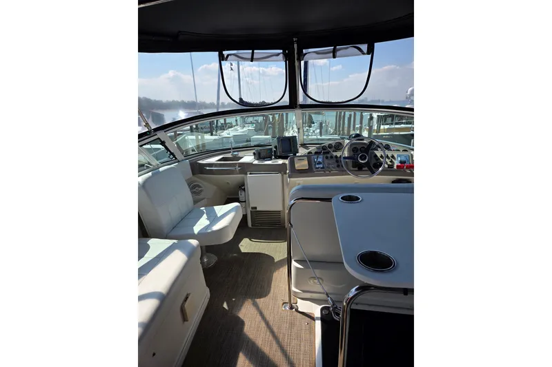 Slide: The Image of Interior view of 1997 Carver 350 Mariner yacht cockpit with steering wheel and seating. - 14