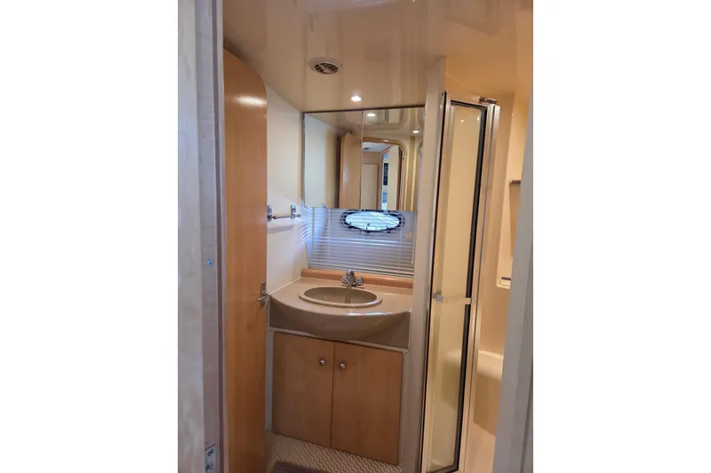 Slide: The Image of Bathroom interior of 1997 Carver 350 Mariner yacht, featuring sink and shower. - 35