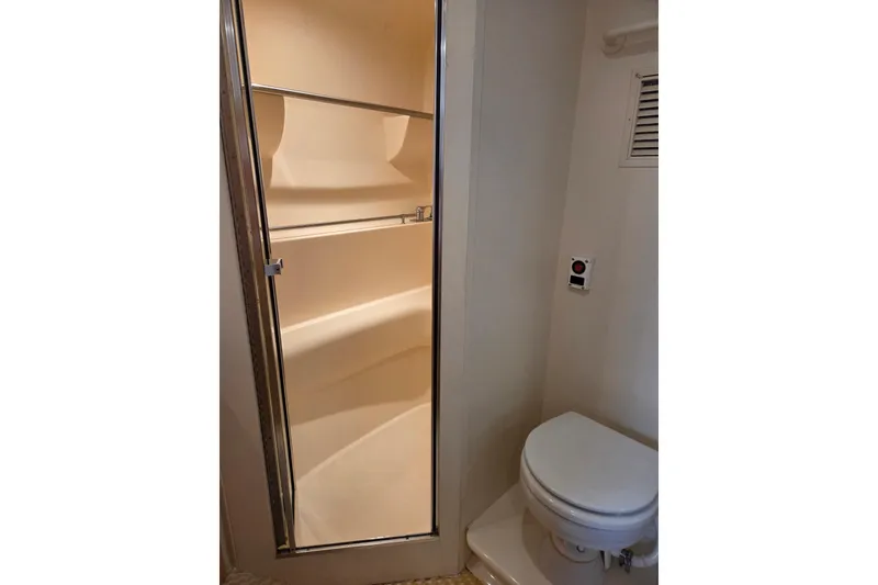 Slide: The Image of 1997 Carver 350 Mariner bathroom with shower and toilet. - 36