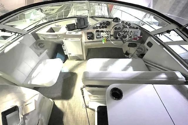 Slide: The Image of 1997 Carver 350 Mariner cockpit with modern controls and seating arrangement. - 8
