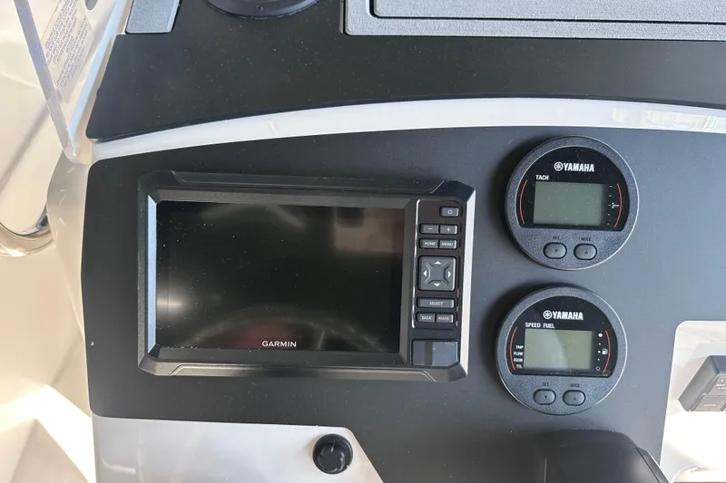 Slide: The Image of Edgewater 170CC 2026 boat dashboard with Garmin display and Yamaha gauges. - 17