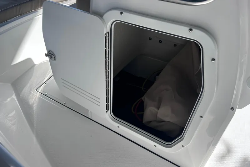 Slide: The Image of Open storage compartment on 2026 Edgewater 170CC boat, showcasing interior space. - 20