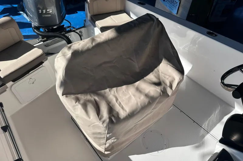 Slide: The Image of 2026 Edgewater 170CC boat interior with covered seat and Yamaha 115 engine. - 21