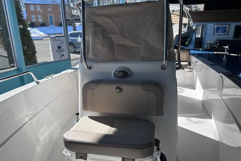 Slide: The Image of Interior of 2026 Edgewater 170CC boat with seating and console in showroom. - 24