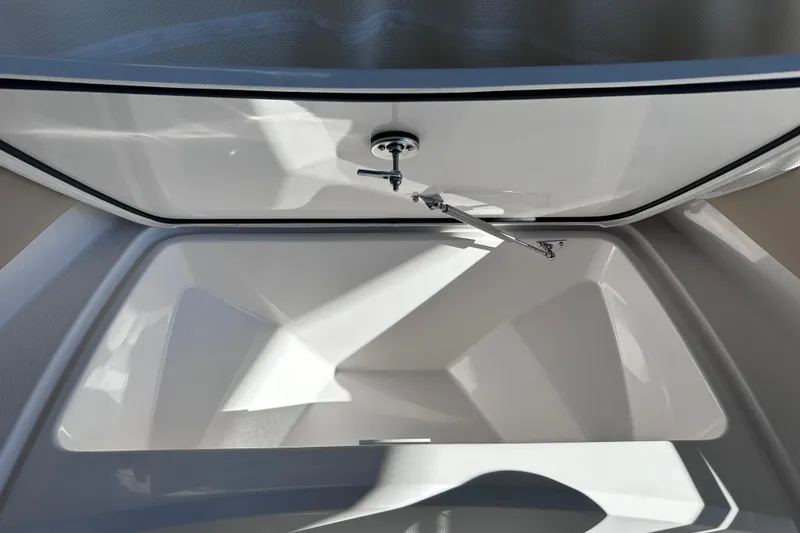 Slide: The Image of Open storage compartment of 2026 Edgewater 170CC boat, showcasing spacious interior design. - 25