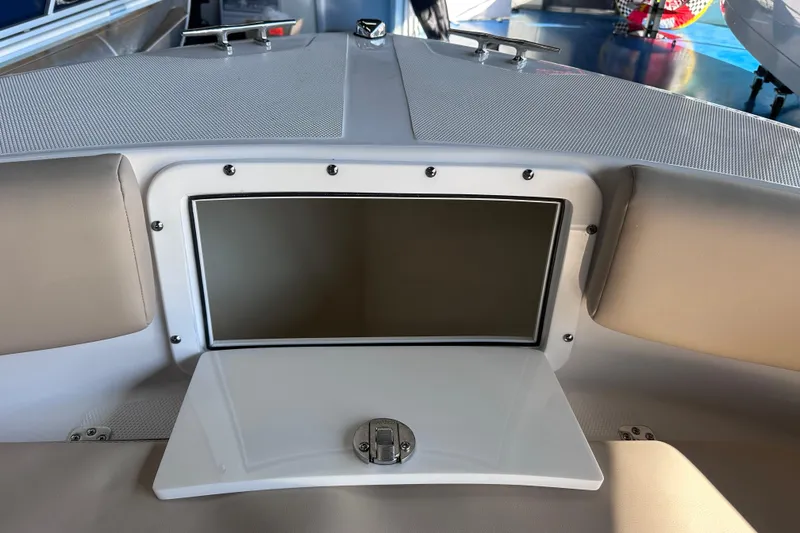 Slide: The Image of 2026 Edgewater 170CC boat interior with open storage compartment. - 26