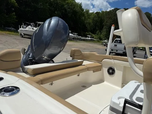Slide: The Image of 2016 Pioneer 197 Islander boat interior with motor, beige seating, and storage compartments. - 3