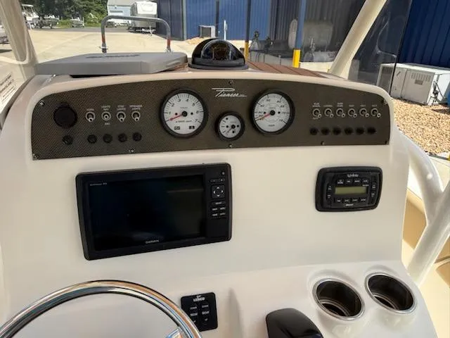 Slide: The Image of Dashboard of a 2016 Pioneer 197 Islander boat with gauges and navigation equipment. - 7