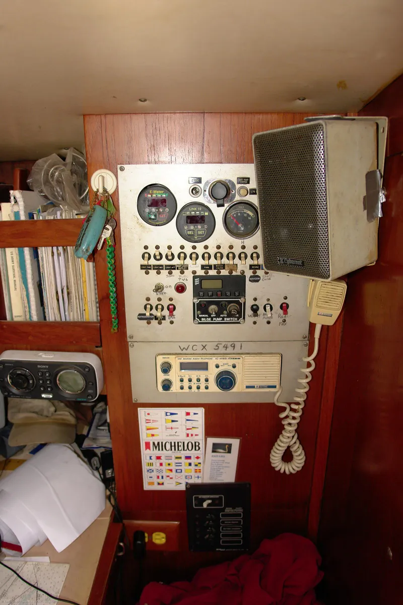 Slide: The Image of Control panel inside a 1973 Nautor Swan 44 yacht, featuring gauges and communication equipment. - 21