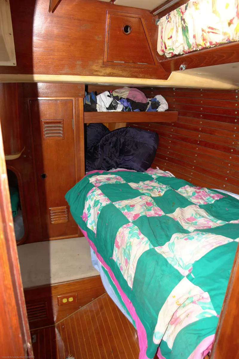 Slide: The Image of Cozy cabin interior of 1973 Nautor Swan 44 sailboat with colorful bedding. - 22