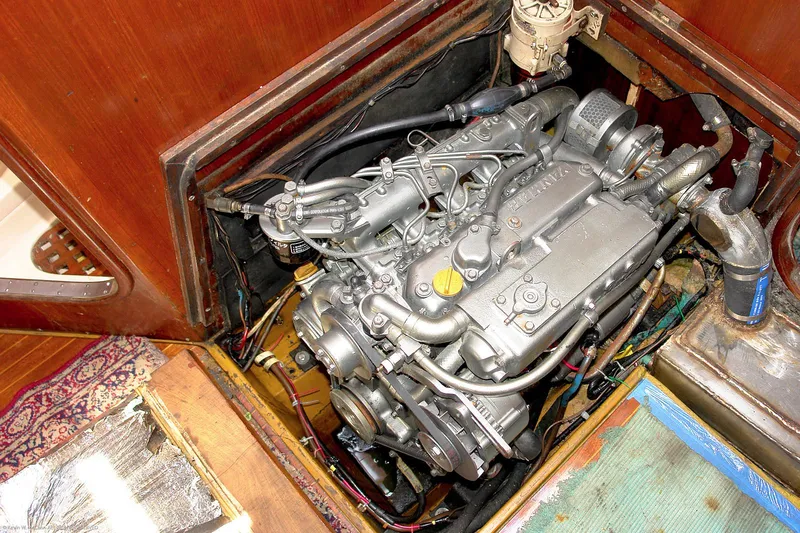 Slide: The Image of Engine compartment of a 1973 Nautor Swan 44 sailboat, showcasing detailed mechanical components. - 26