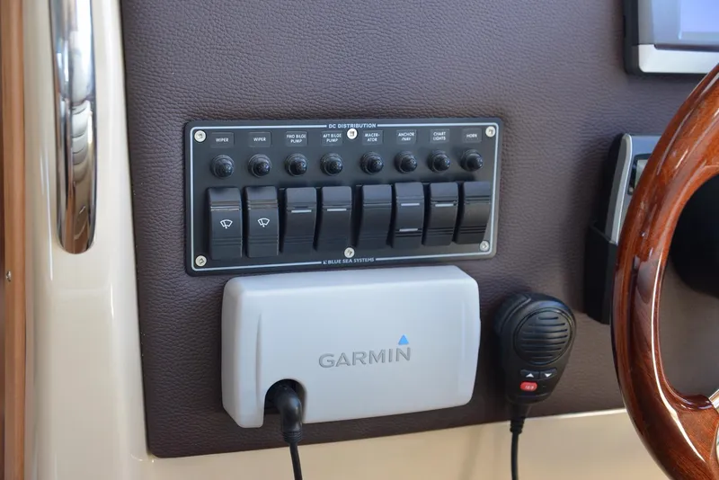 Slide: The Image of Control panel and Garmin device on 2016 Cutwater C26 boat dashboard. - 10