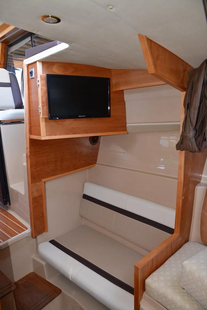 Slide: The Image of Interior of 2016 Cutwater C26 boat with seating and mounted TV. - 12