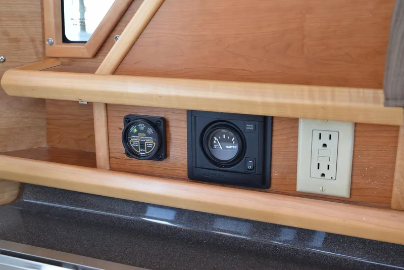 Slide: The Image of Control panel and outlet on 2016 Cutwater C26 boat interior. - 8