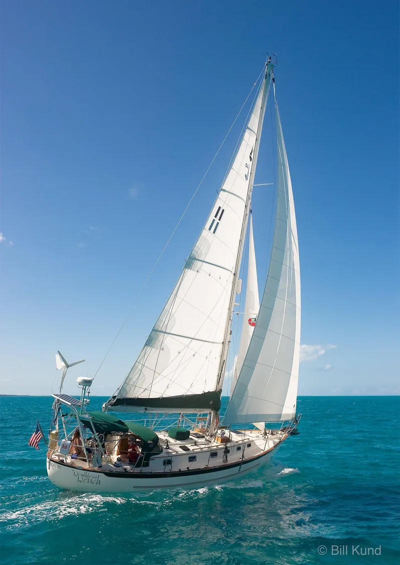 Slide: The Image of 2025 Pacific Seacraft 40 sailboat navigating clear blue ocean waters. - 10