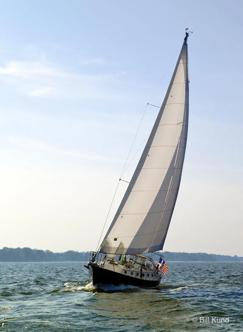 Slide: The Image of 2025 Pacific Seacraft 40 sailboat navigating open waters under clear skies. - 2