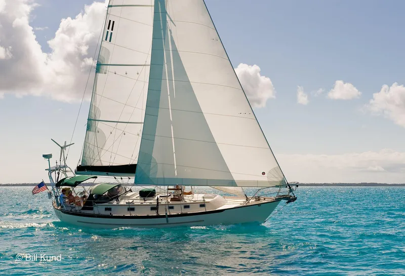 Slide: The Image of 2025 Pacific Seacraft 40 sailboat cruising on clear blue ocean under sunny skies. - 3