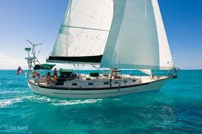 Slide: The Image of Sailing yacht Pacific Seacraft 40, 2025 model, cruising on clear turquoise waters. - 4