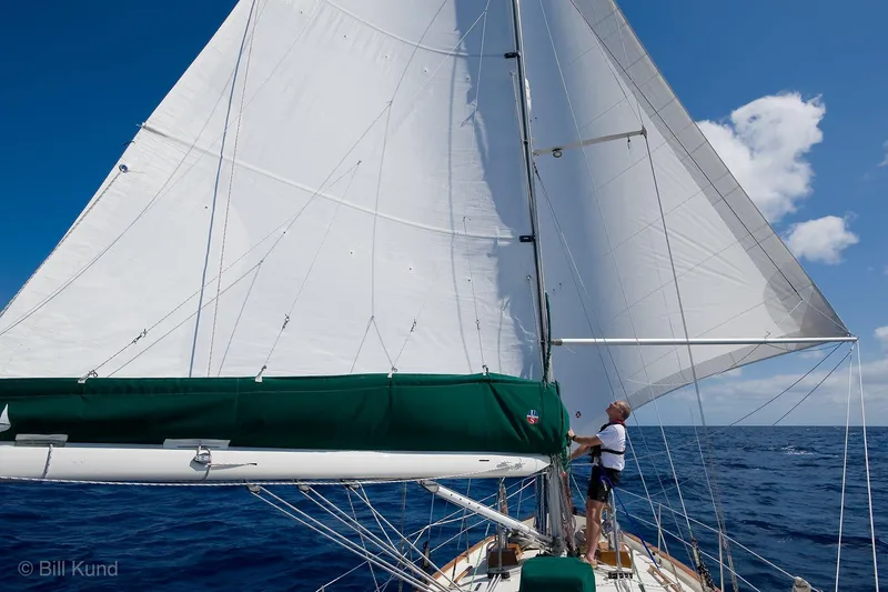 Slide: The Image of Sailboat Pacific Seacraft 40, 2025 model, sailing on open ocean under clear blue sky. - 5