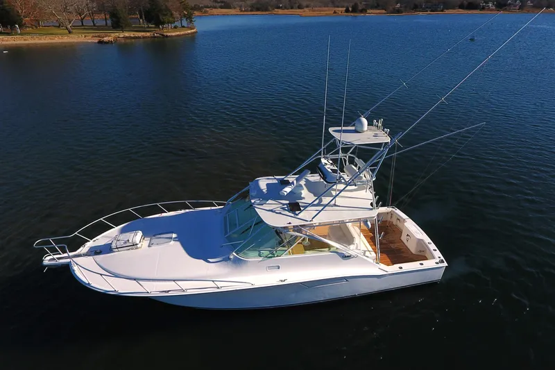 Slide: The Image of 2004 Cabo Express boat on calm water, aerial view, clear sky. - 12