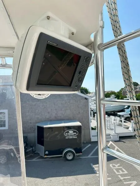 Slide: The Image of Boat navigation system on a 2004 Cabo Express, dockside view in the background. - 30