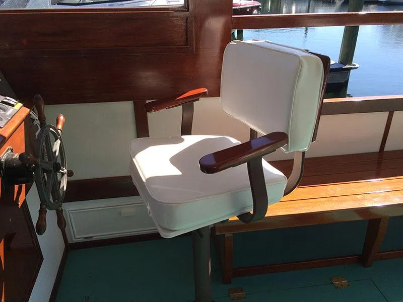 Slide: The Image of Captain's chair on 1934 Classic Cruiser Hemingway's Pilar Replica boat. - 10