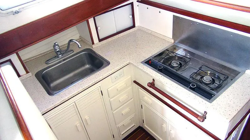 Slide: The Image of Compact galley kitchen in 1934 Classic Cruiser Hemingway's Pilar Replica with sink and stove. - 12