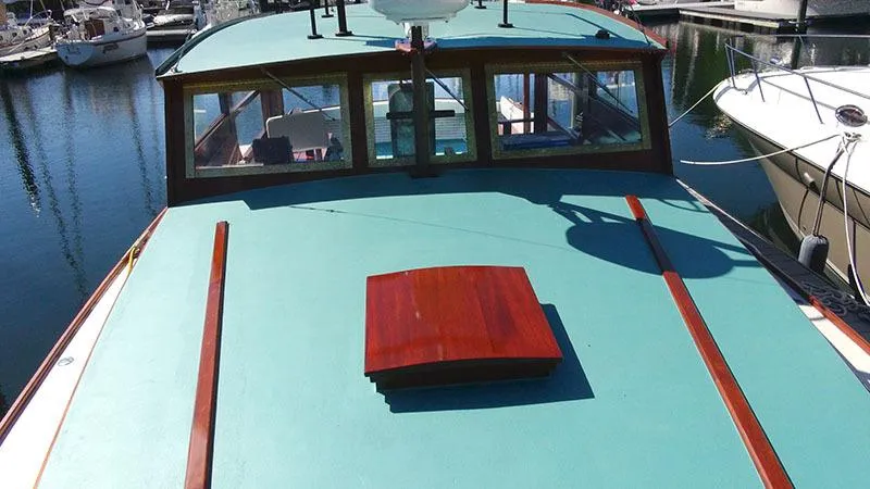 Slide: The Image of 1934 Classic Cruiser Hemingway's Pilar Replica on water, showcasing vintage design and craftsmanship. - 14