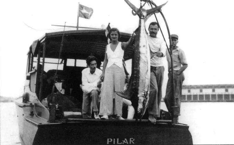 Slide: The Image of 1934 Classic Cruiser Hemingway's Pilar Replica with group displaying large fish catch. - 4
