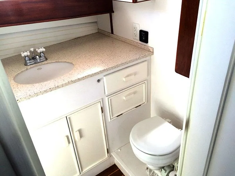 Slide: The Image of 1934 Classic Cruiser Hemingway's Pilar Replica bathroom with white fixtures and compact design. - 5
