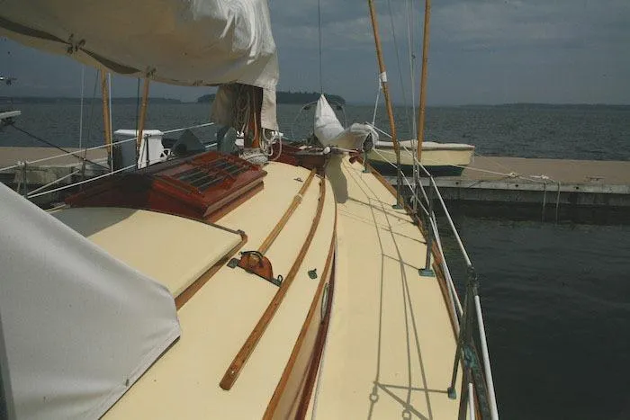 Slide: The Image of 1958 Concordia Yawl sailboat docked at a marina. - 13