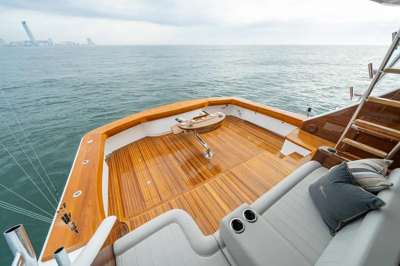 Slide: The Image of 2024 Viking 82 Convertible yacht deck with ocean view. - 11