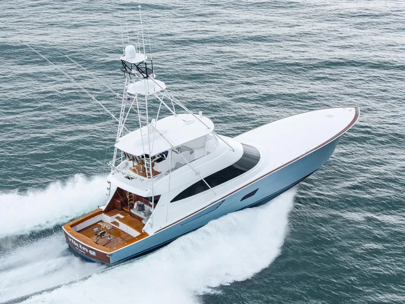 Slide: The Image of 2024 Viking 82 Convertible yacht cruising on open water. - 3
