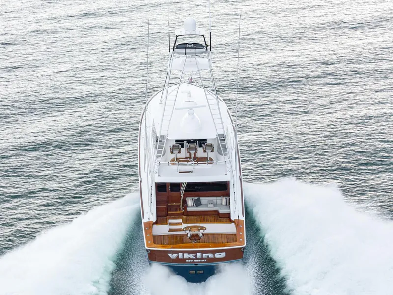 Slide: The Image of 2024 Viking 82 Convertible yacht cruising on the ocean. - 4