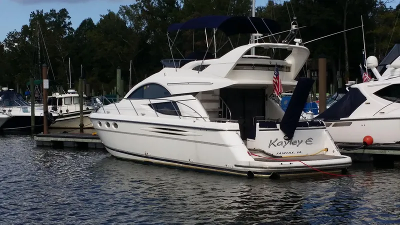 Slide: The Image of 2006 Fairline Phantom yacht docked at a marina. - 0