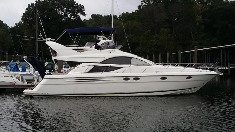 Slide: The Image of 2006 Fairline Phantom yacht docked in a marina. - 1