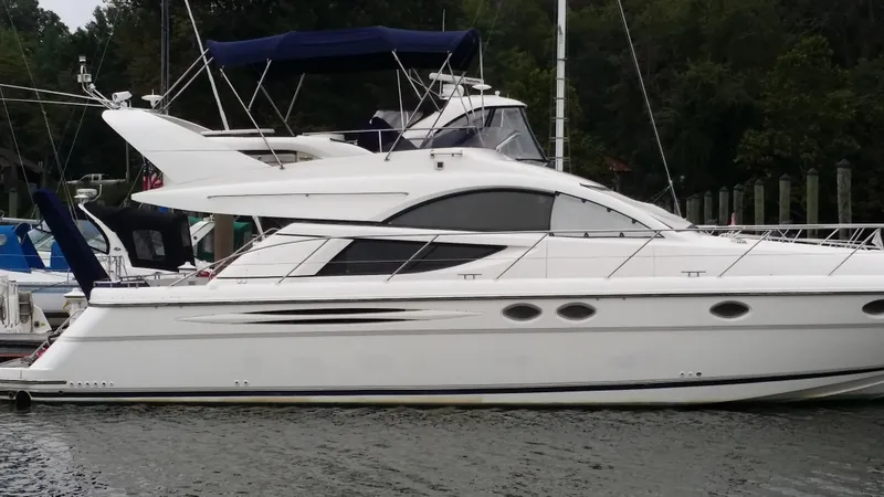 Slide: The Image of 2006 Fairline Phantom yacht docked at marina. - 10