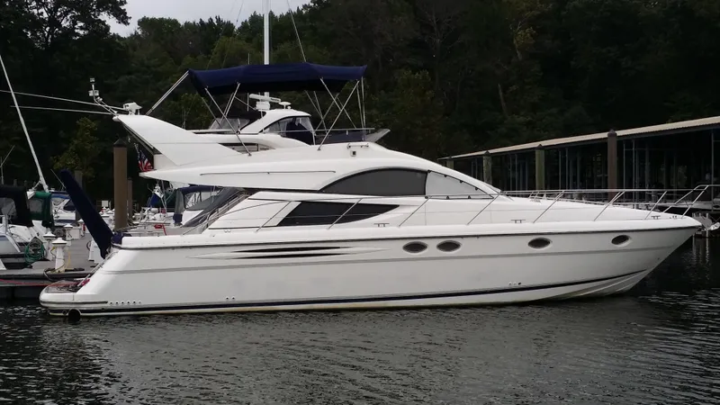 Slide: The Image of 2006 Fairline Phantom yacht docked in a marina. - 11