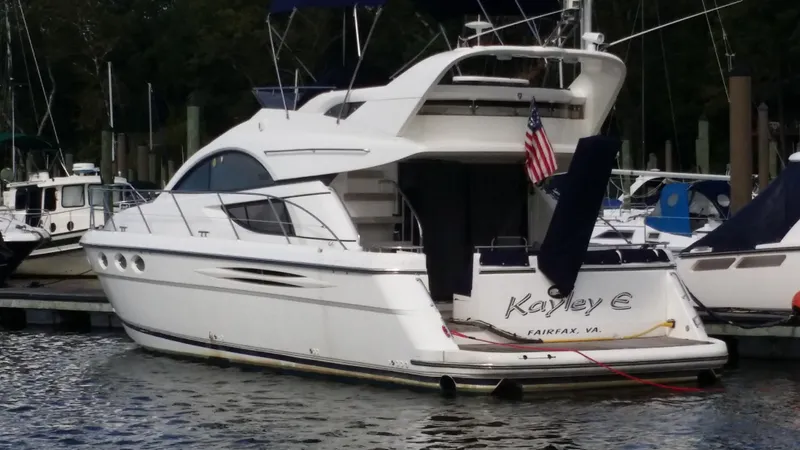Slide: The Image of 2006 Fairline Phantom yacht docked at marina, rear view. - 2