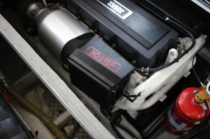 Slide: The Image of Engine compartment of a 2006 Fairline Phantom boat with NO STEP label and fire extinguisher. - 24