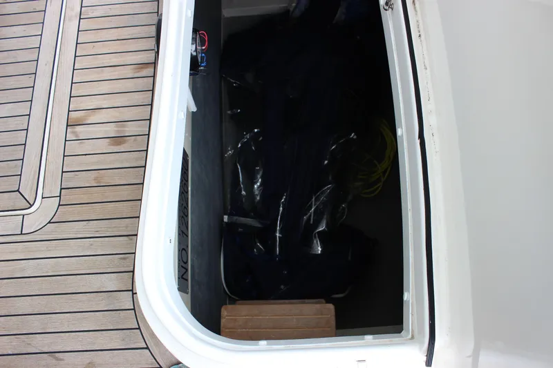 Slide: The Image of Storage compartment on a 2006 Fairline Phantom yacht with wooden deck. - 31